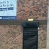 Community and Business Partners in Blackburn with doors shut