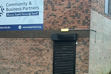 Community and Business Partners in Blackburn with doors shut