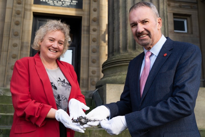 Michael Conlon, Chairman of Conlon Construction handing over The Harris ceremonial key to Councillor Anna Hindle, Cabinet Member for Culture and Arts at Preston City Council