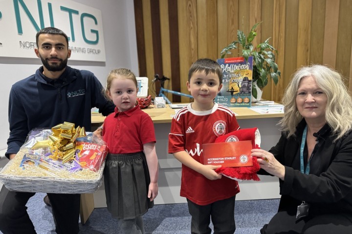 DAISY AND ATTICUS RECEIVING THEIR PRIZES AS WINNERS OF THE ACCRINGTON HALLOWEEN TRAIL COMPETITION.jpg.jpg