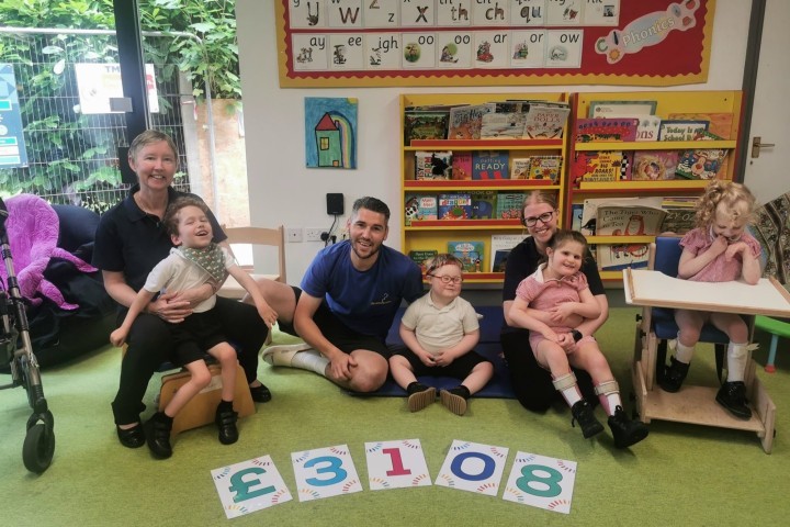 Josh Norgate with children and staff at Rainbow Hub.jpg.jpg