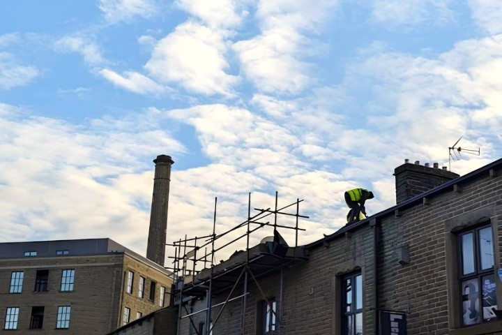 Man on a roof demo picture.JPG.jpg